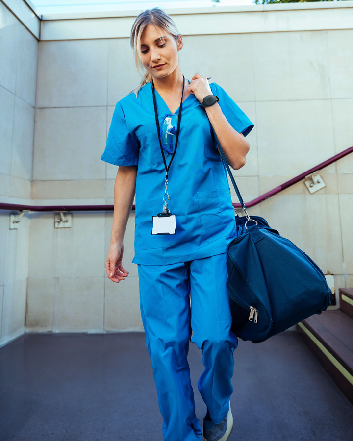 Nurse walking with the silent beacon panic button